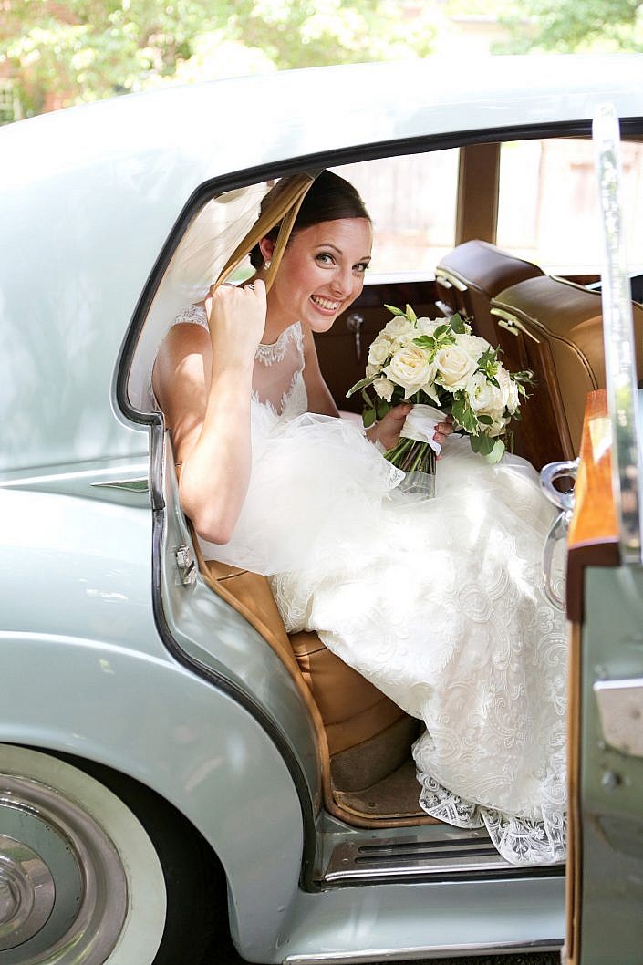 bride in vintage getaway car